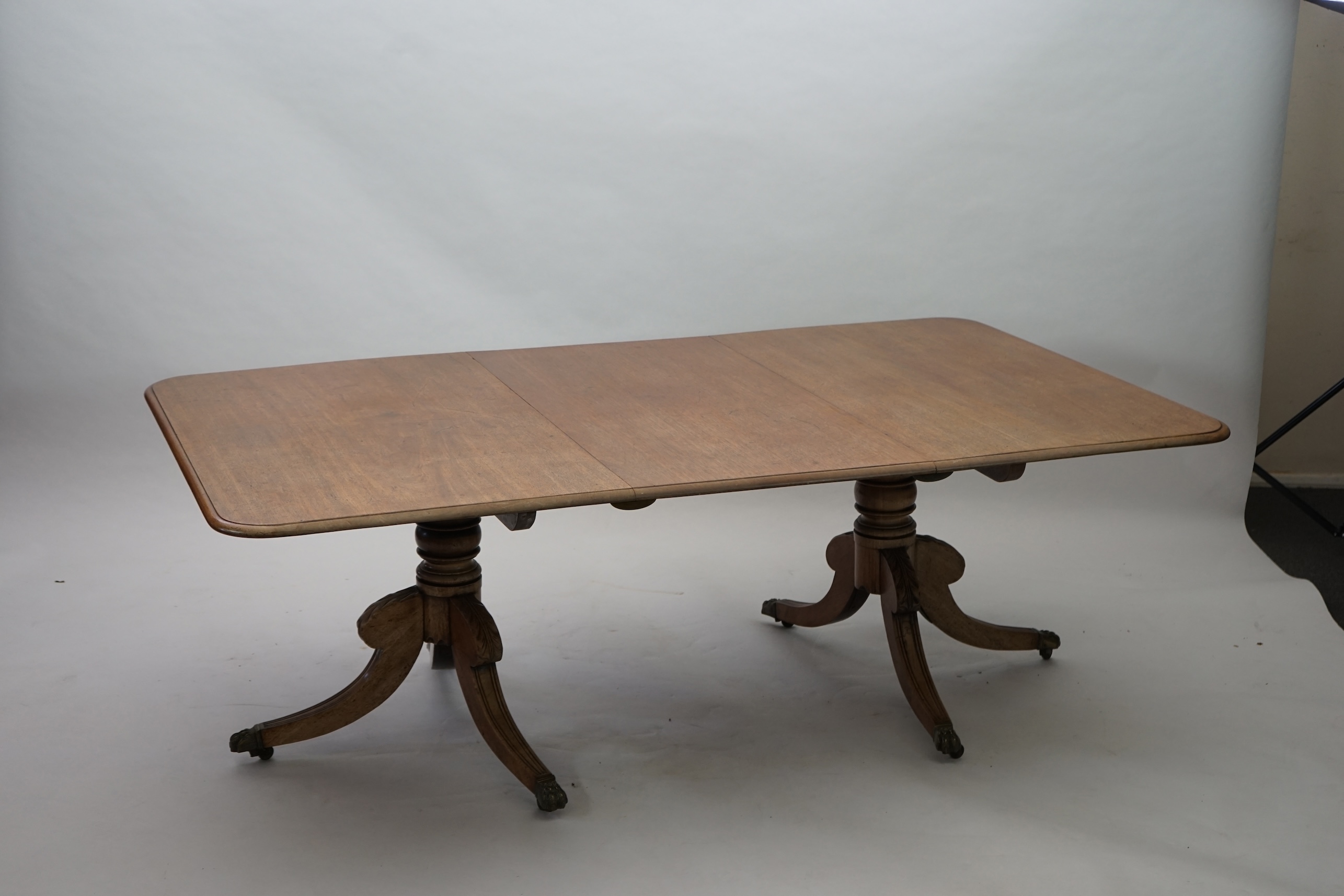 A Regency mahogany extending dining table